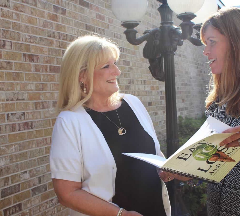 Photo of successful client Evalyn standing with author Andi Holyfield