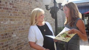 Photo of successful client Evalyn standing with author Andi Holyfield